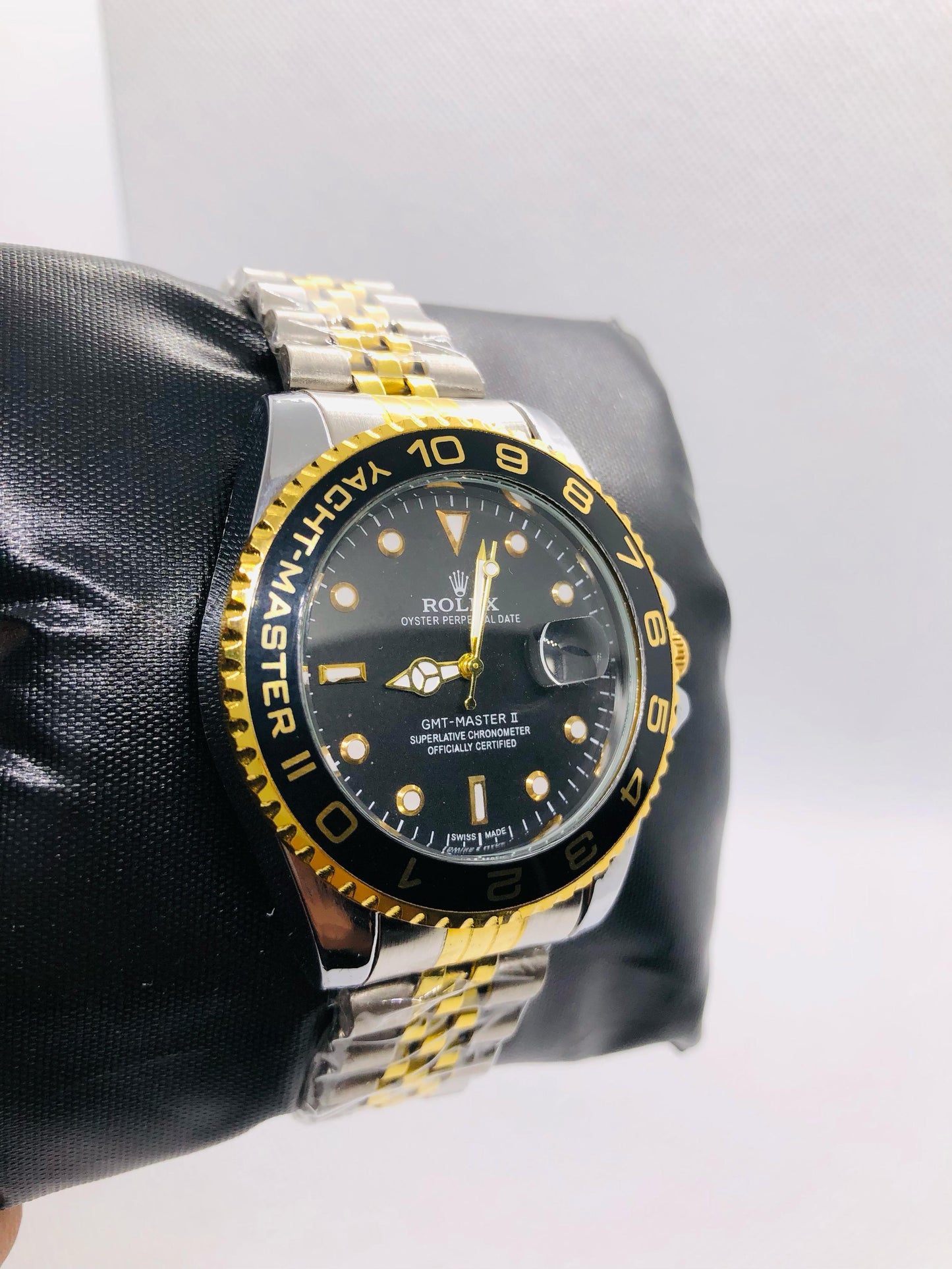 Rolex with Black and Golden Rotating Dila and Date